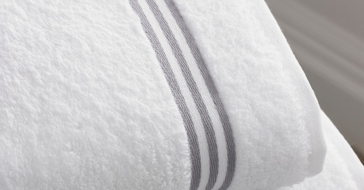 Folded white towels, representing the hotel and spa supplies category