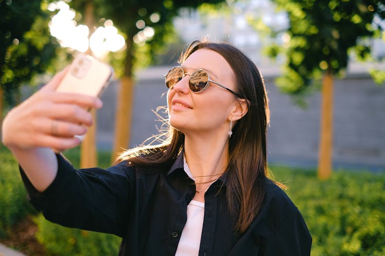 Smiling Woman Taking A Selfie