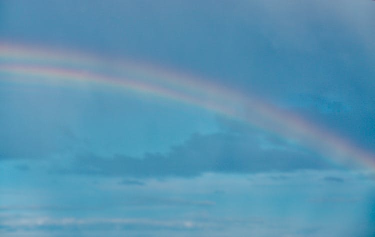 Rainbow On A Blue Sky