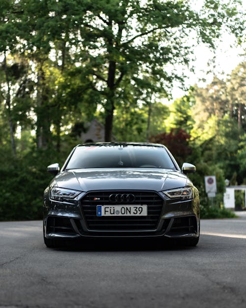 Black Sedan Car Parked on a Concrete Road