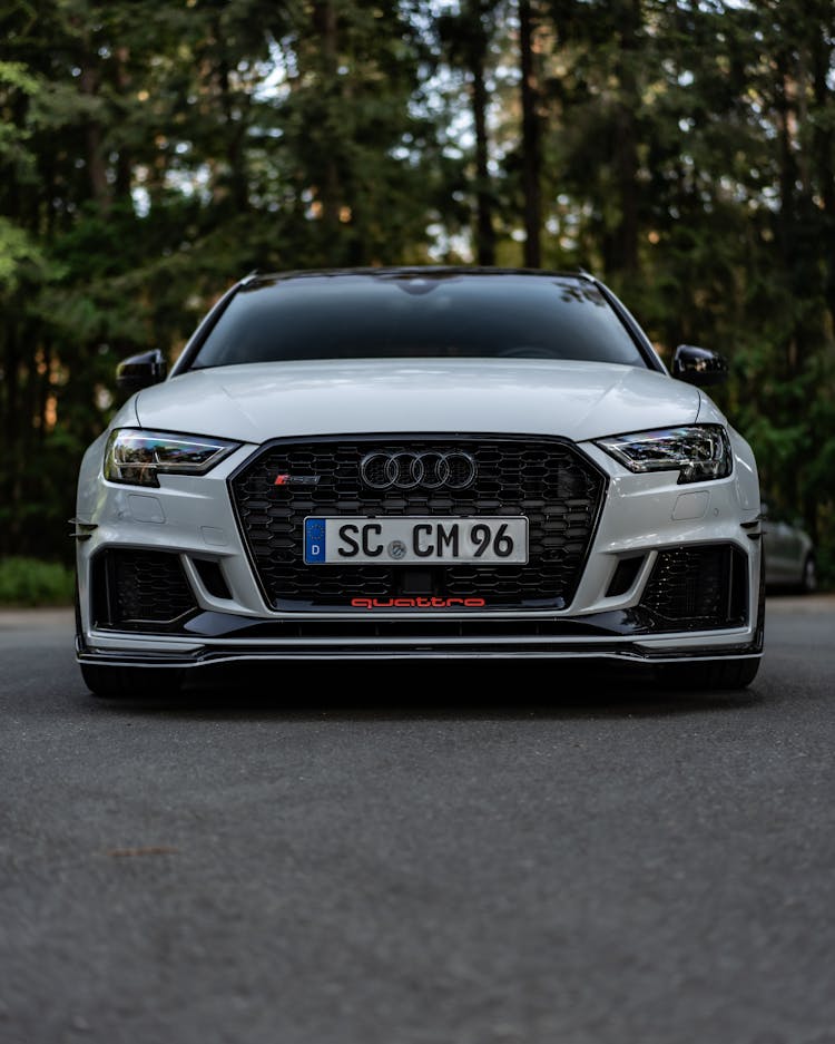 White Audi RS3 Parked On An Asphalt Ground