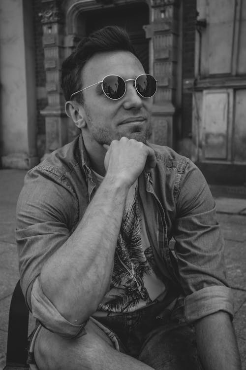 A Grayscale of a Man Wearing Sunglasses