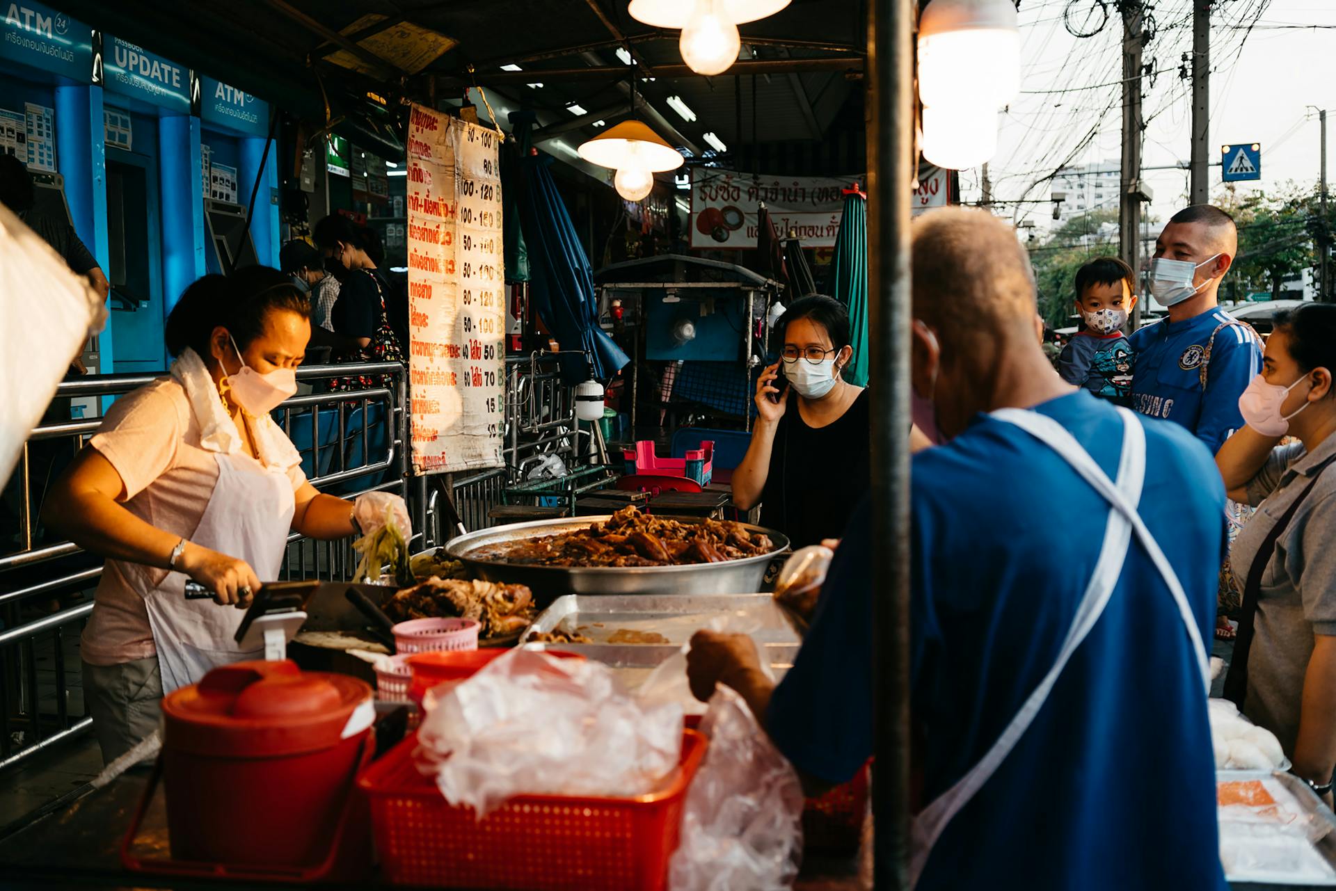 People Buying Food on Street Vendor