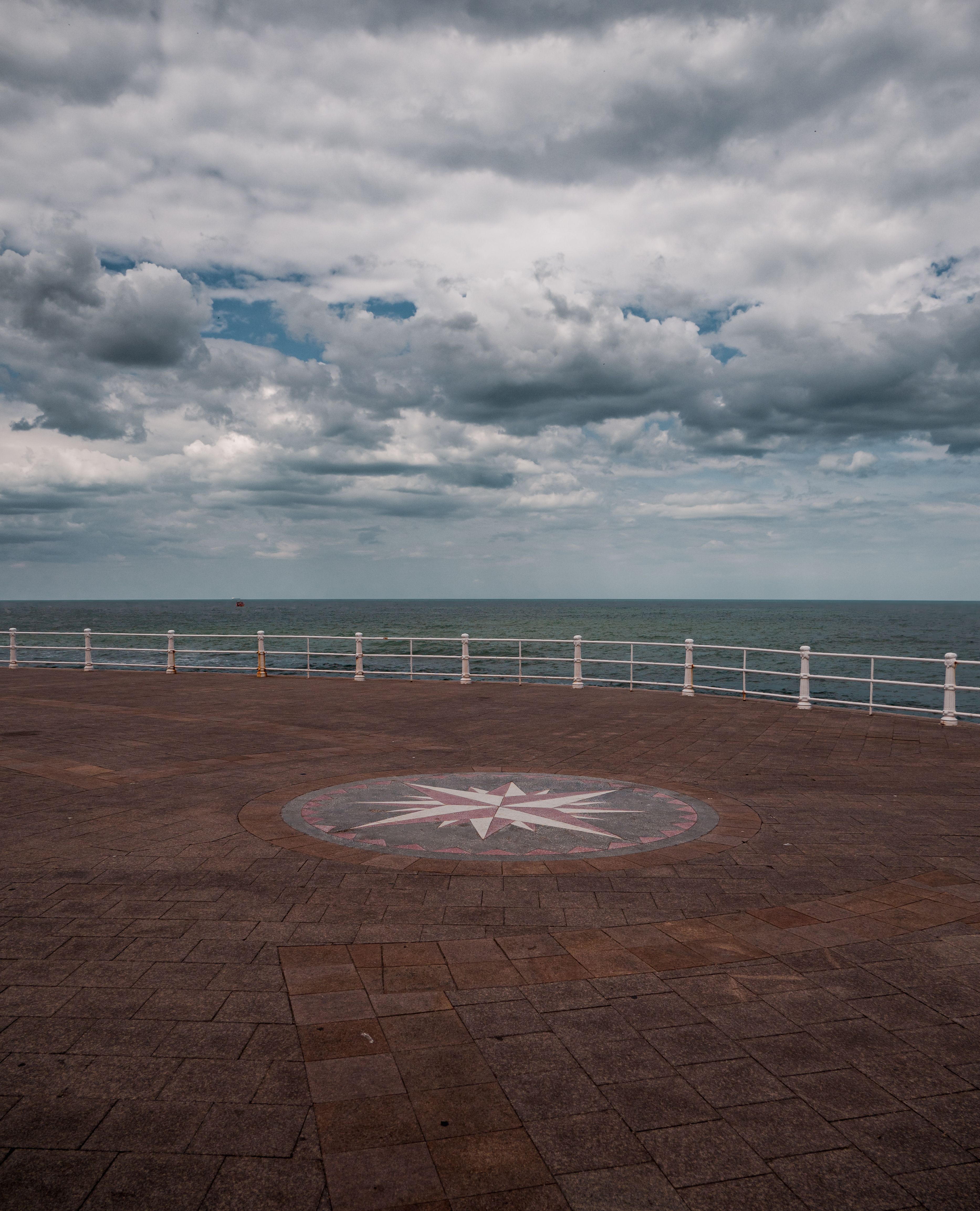 Pier and Sea under the Cloudy Sky · Free Stock Photo