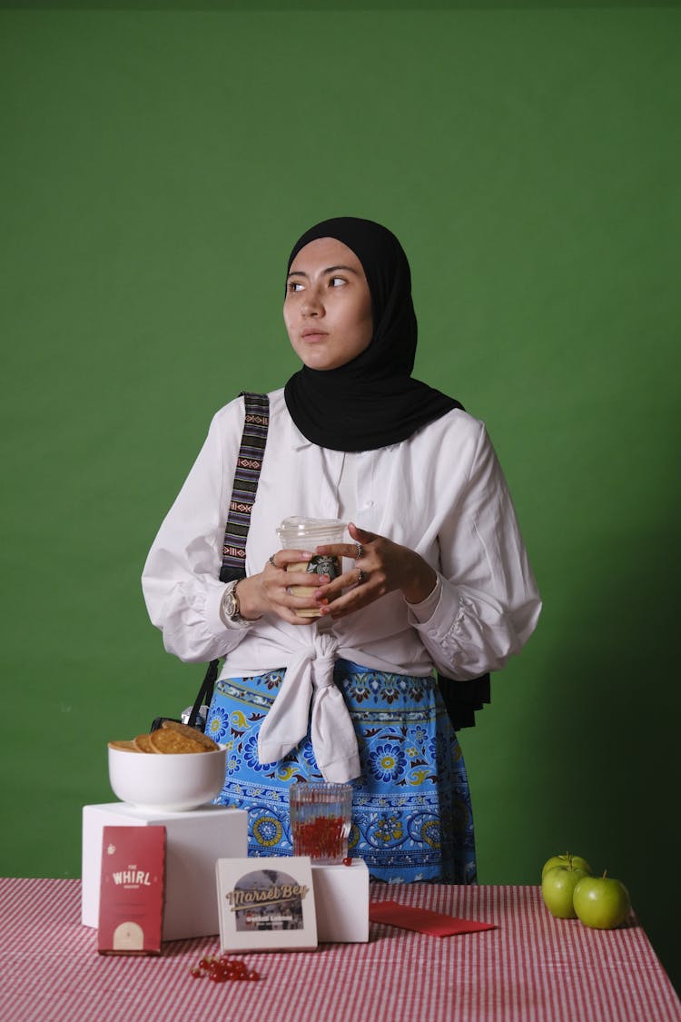 Woman With Hijab Holding Plastic Cup Of Coffee