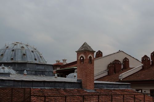 Free Rooftop view showcasing distinct historical architecture with domes and chimneys. Stock Photo
