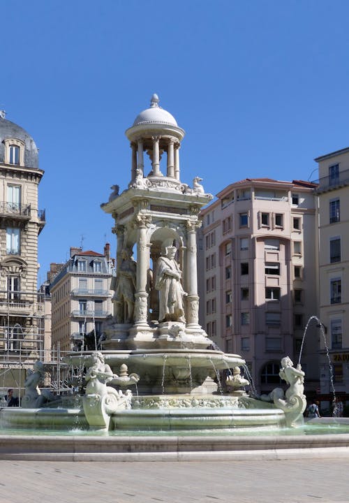 The Famous Jacobin's Fountain in Lyon, France Under Blue Sky