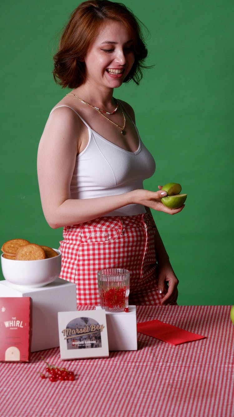 Smiling Young Woman Cooking In Retro Studio