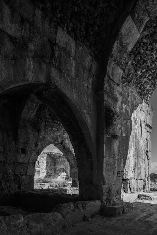 Black and White Photo of Medieval Architecture with Arches