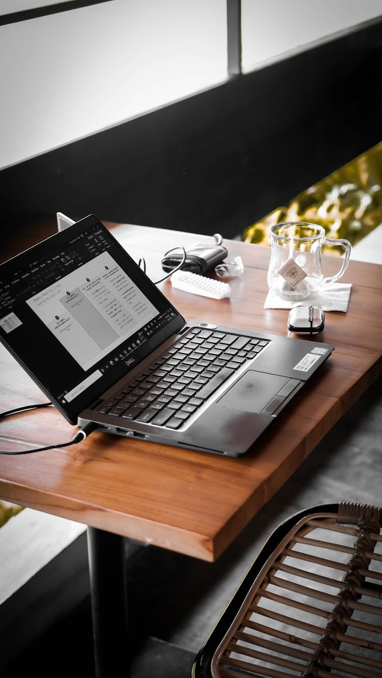 Open Laptop Lying On Coffee Table