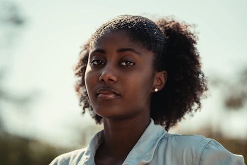 Close-Up Shot of a Curly-Haired Woman