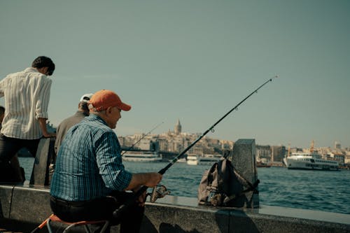 Photo of a Man Holding Fishing Rod