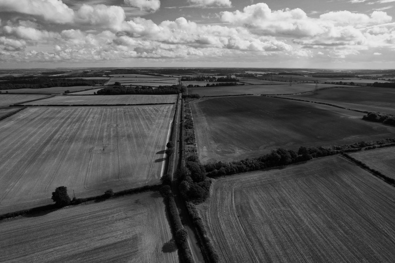 black and white aerial view of rural fields and roads in england s cou