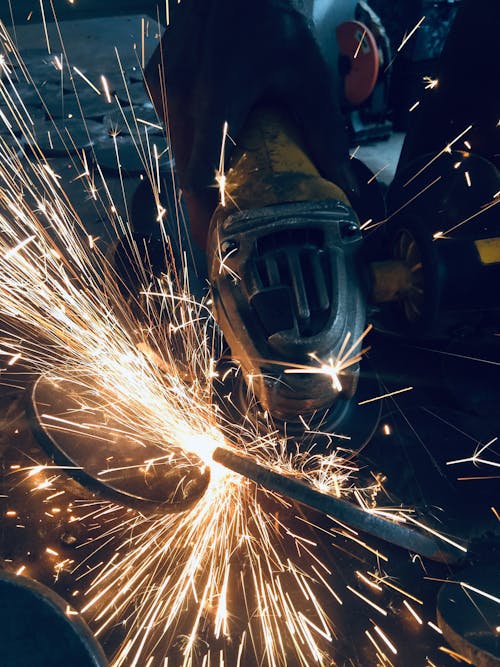 Close-up of a Person Using a Grinder 