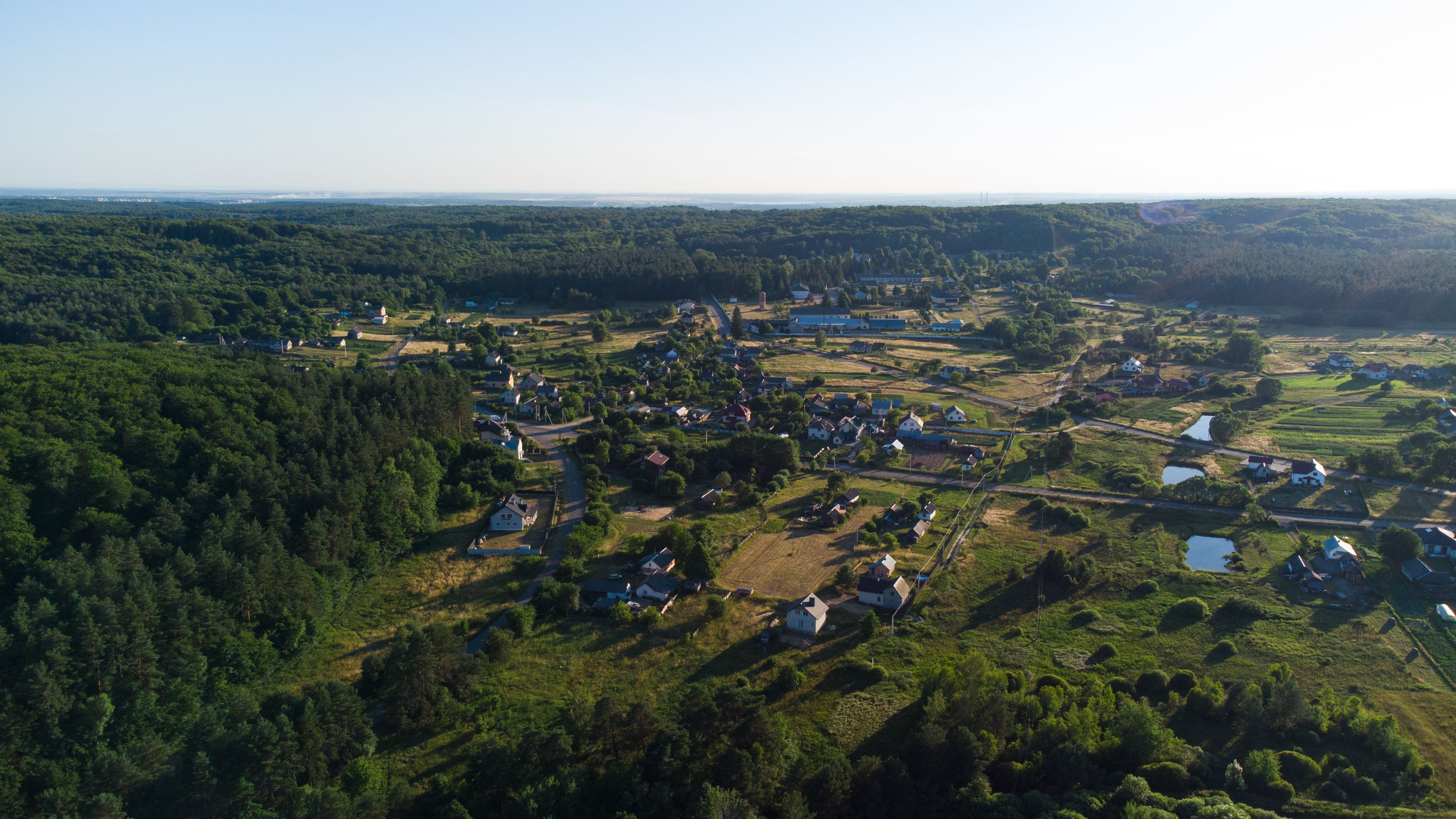 Aerial View of Houses by the River in the Countryside · Free Stock Photo