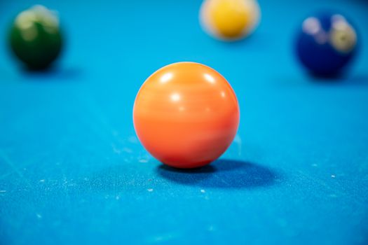 Close-up shot highlighting colorful billiard balls on a blue pool table. Perfect for leisure themes.