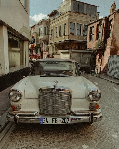 A White Vintage Car Parked on the Street