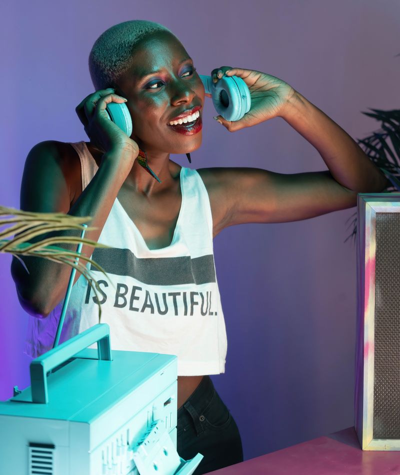 Host Dre Calloway smiling with headphones on