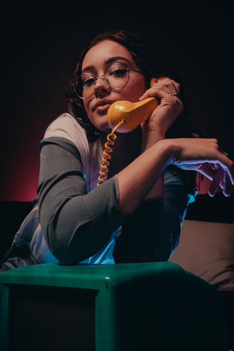 Woman Holding An Old Telephone 