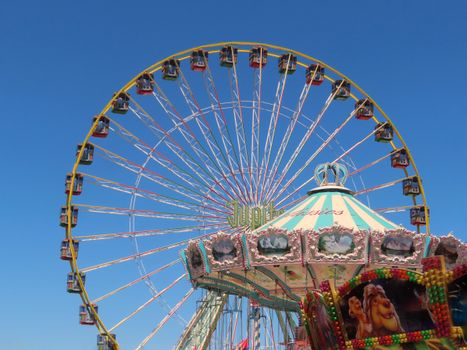 People Riding on White and Blue Ferris Wheel