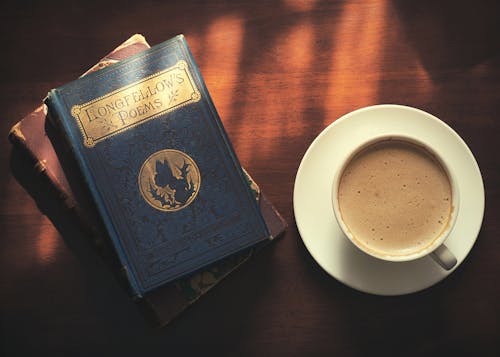 Books near Cup of Coffee