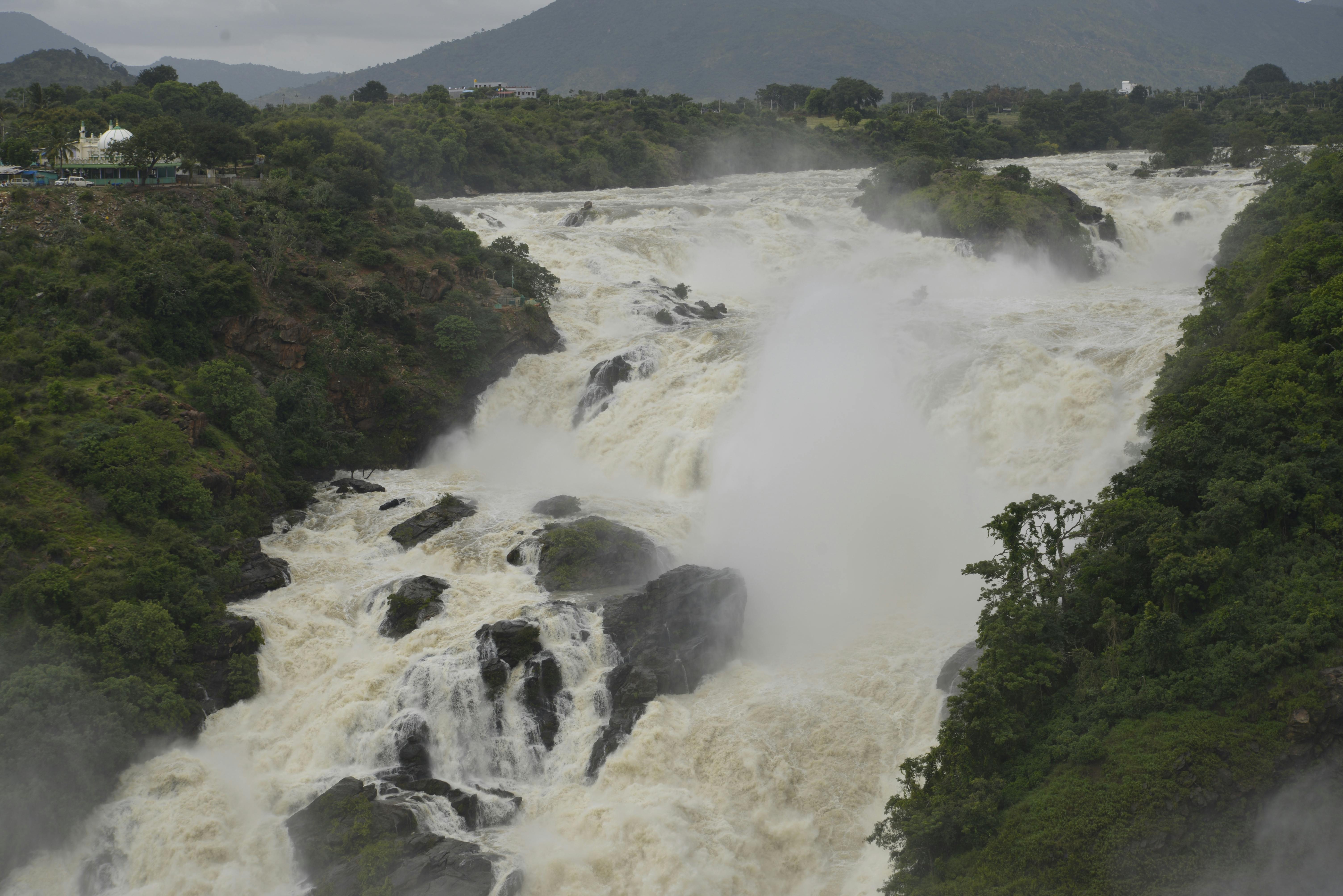 A tropical waterfall cascading through lush green jungle — the kind of natural feature that defines El Valle de Antón's environment.