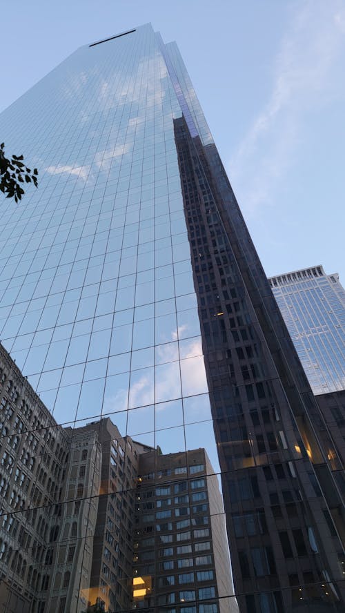 Low Angle Shot of a Modern Skyscraper with Glass Facade 