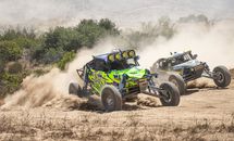 Green and Black F 1 Car on Dirt Road