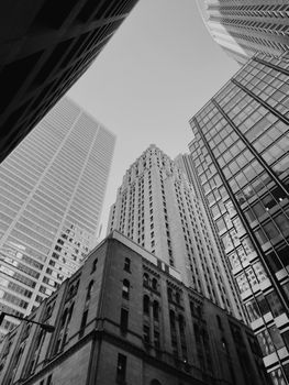 Low angle monochrome view of Toronto's urban skyscrapers with dramatic architecture.