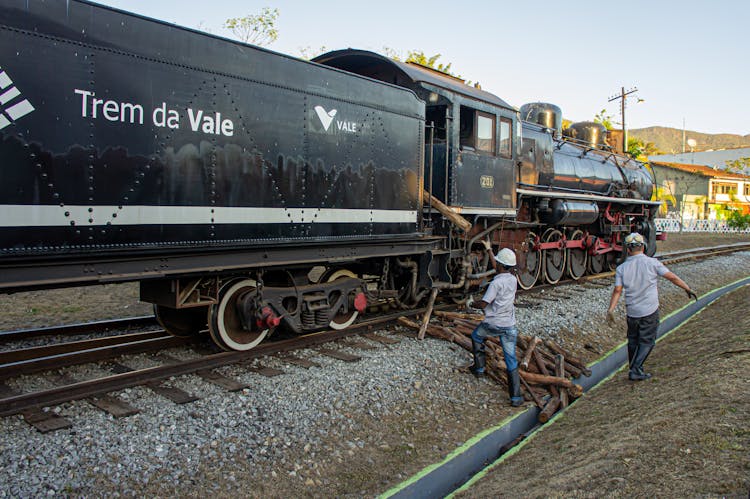 Workers Loading Wood To Train