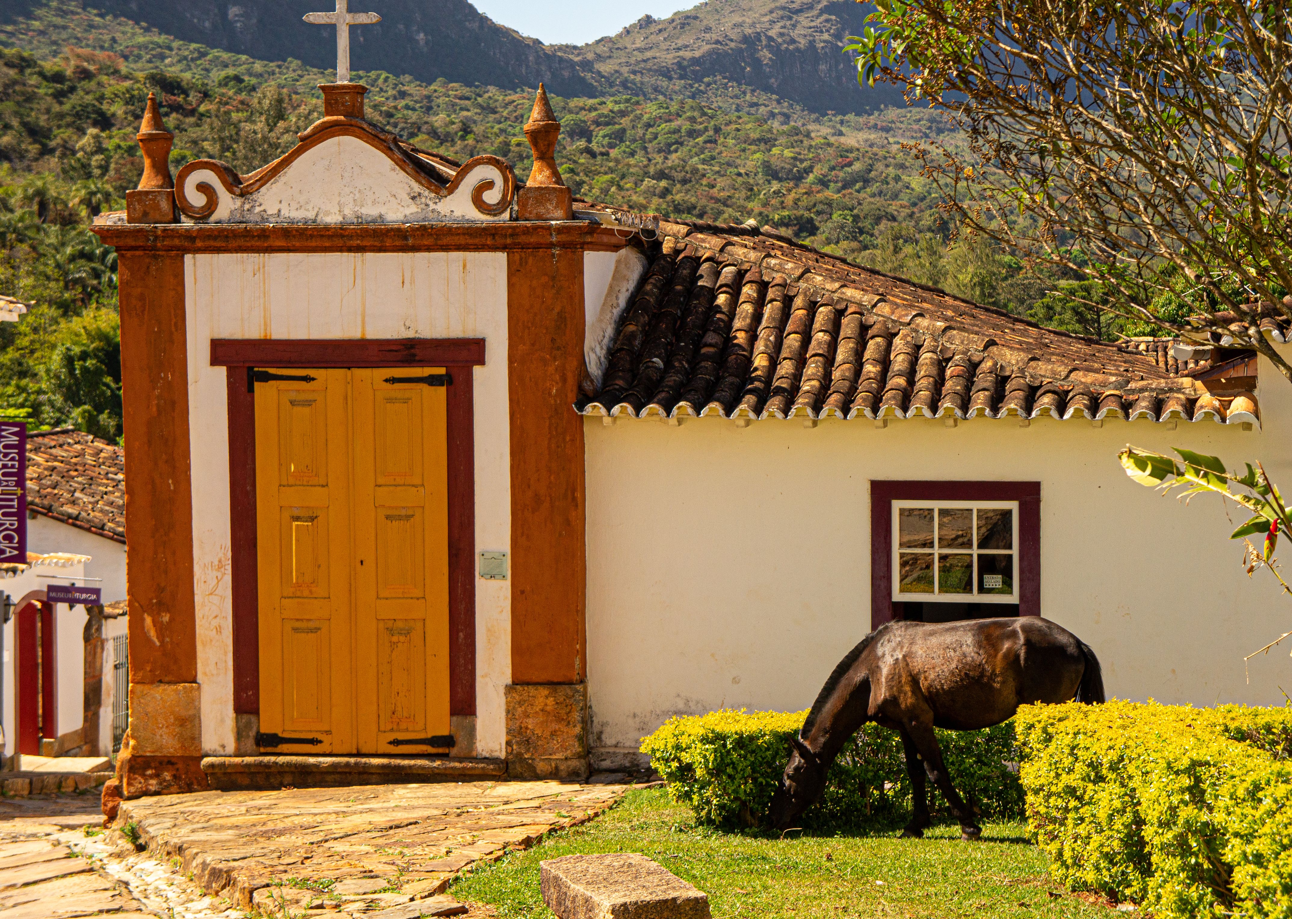 Historic colonial buildings with colorful facades in mountainous Brazilian town