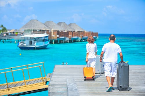 Free Man and Woman Walks on Dock Stock Photo