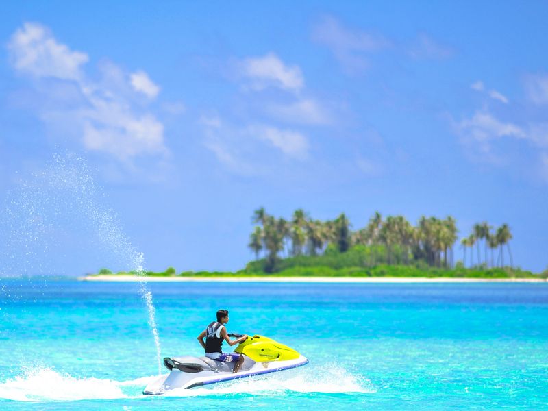 Jet ski near an island in Kaafu Atoll, Maldives