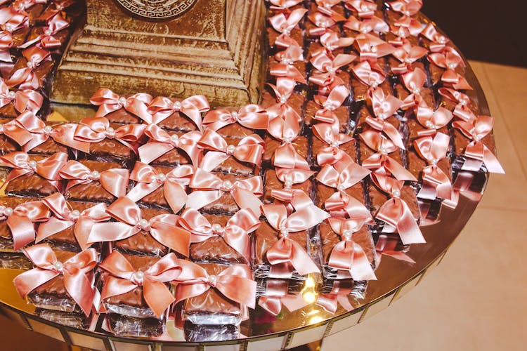 Pieces Of Cake Wrapped In Foil And Decorated With Bow