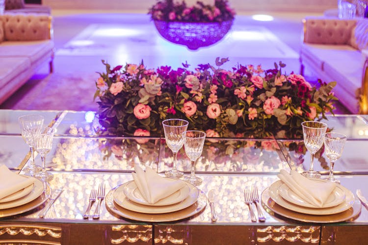 Empty Plates And Glasses On A Glass Dining Table