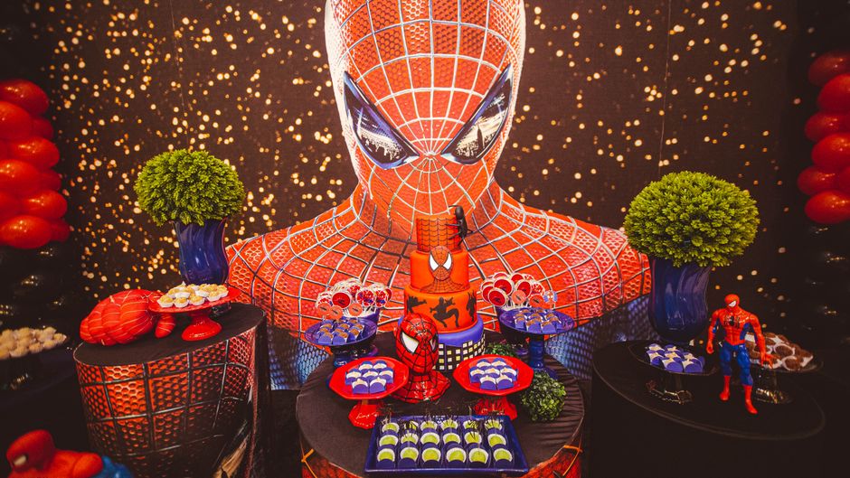 Vibrant Spiderman themed party setup with decorations and snacks, ideal for children's celebrations.