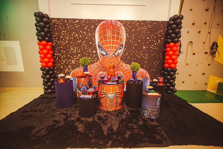 Pedestals With Candies And Toys In A Spider-Man Themed Area