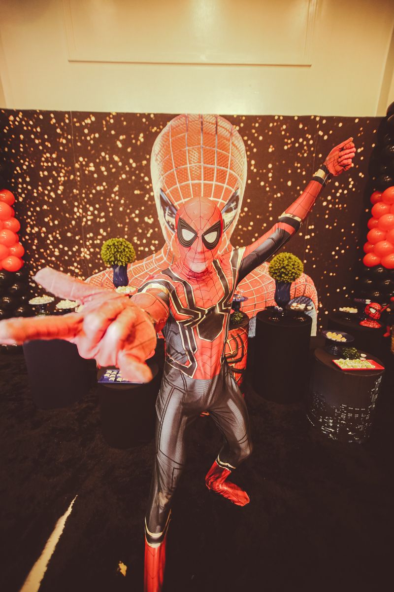 Child dressed as Spider-Man at a birthday party