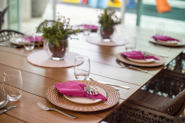 Clear Glasses On Brown Wooden Table