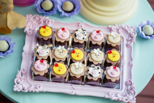 White and Black Cupcakes on White Plastic Tray