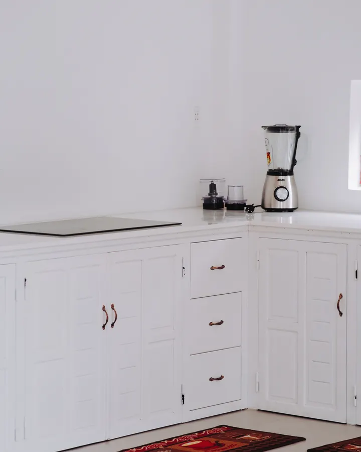 Refrigerator Maintenance Checklist for San Diego Homes White kitchen corner with sleek cabinets