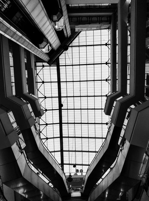 Free Architectural design of a mall atrium ceiling in monochrome with geometric patterns. Stock Photo