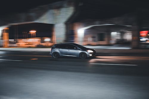 Free Black Sedan on Road during Night Time Stock Photo