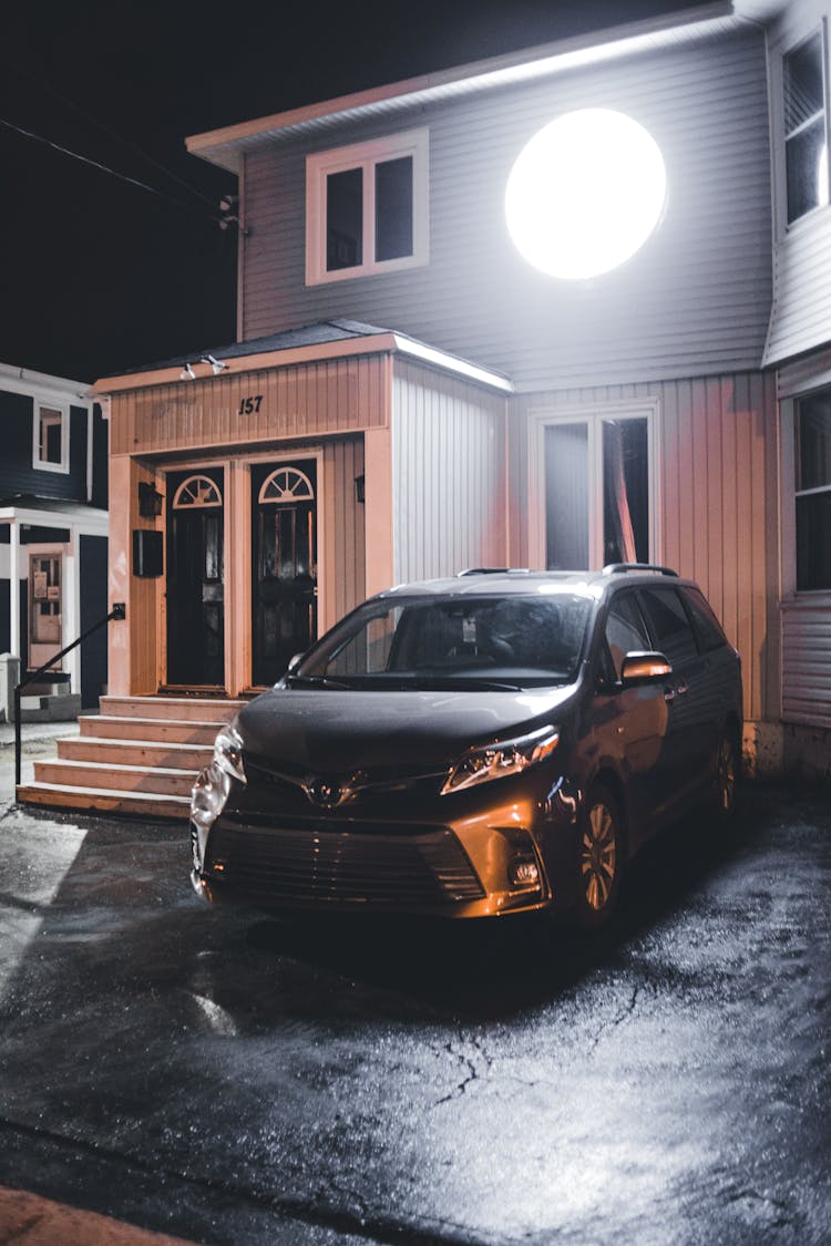 Car Near Wooden House At Night