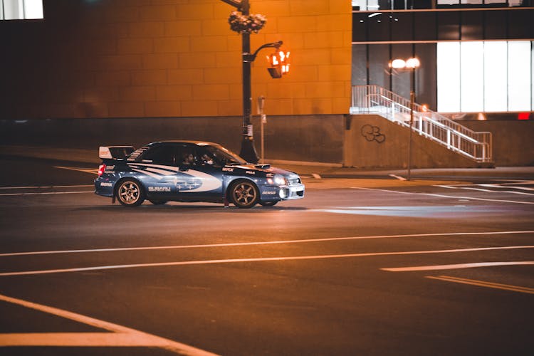 Rally Subaru Impreza On Street At Night