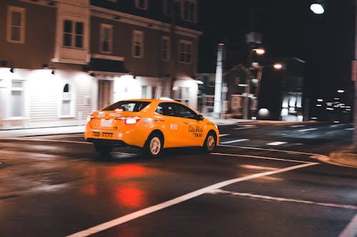 Yellow Taxi Cab on the Road