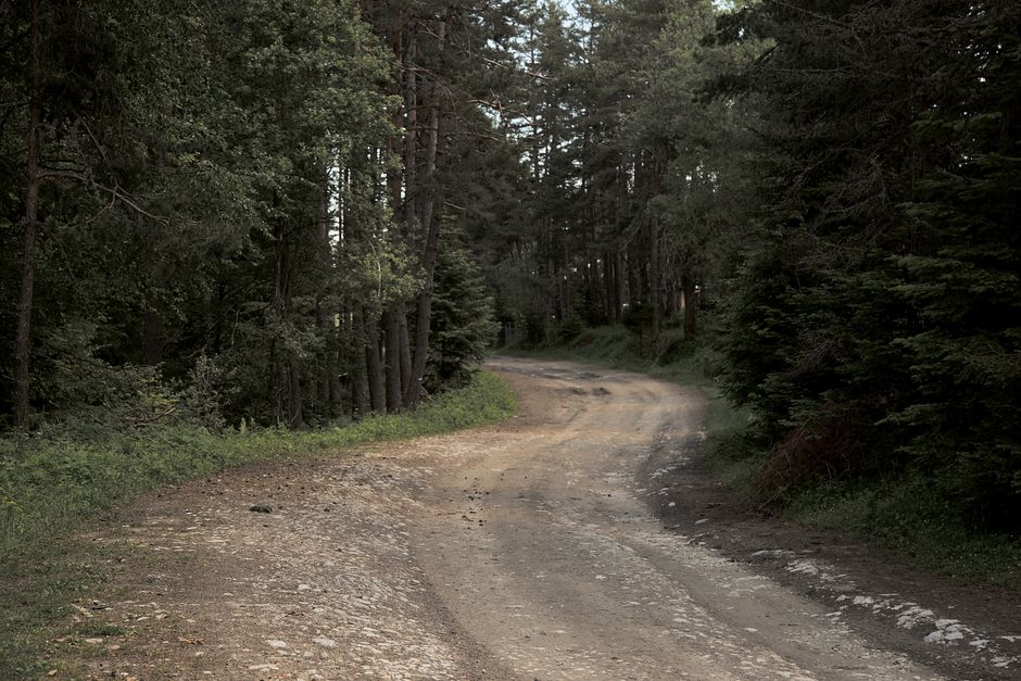SUV driving on an unpaved rural road in the Albanian countryside