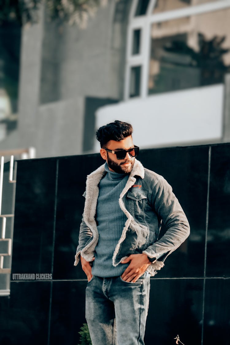 Man Wearing A Black Sunglasses And Jean Jacket