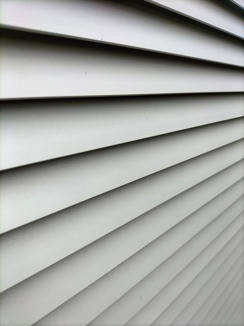 Free Detailed shot of horizontal window blinds showcasing lines and light play. Stock Photo