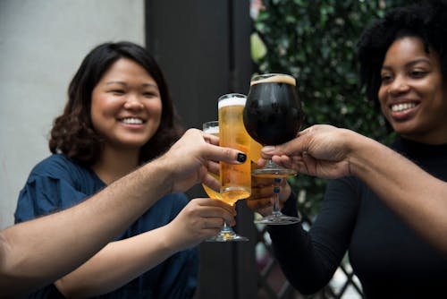 Women Holding Glasses Having Toasting